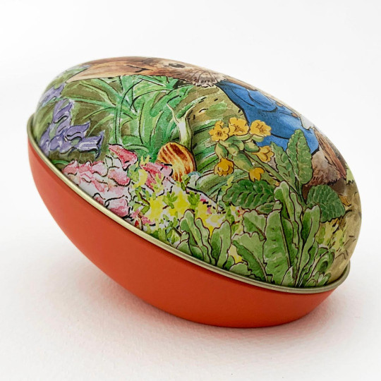 Peter Rabbit Metal Easter Egg Tin ~ 4-1/4" tall ~ Peter in Garden on Orange